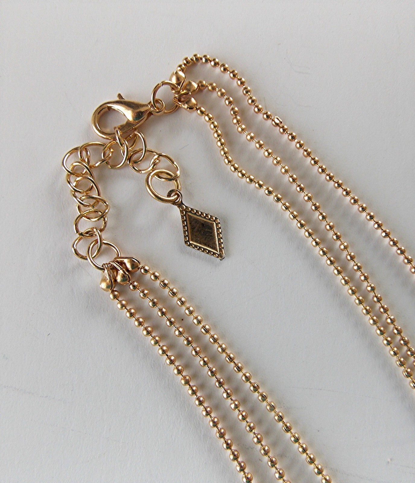 MULTI-LAYER GOLDTONE ADJ. 3 STRAND STAR, HEART, & CRESCENT MOON PENDANT NECKLACE