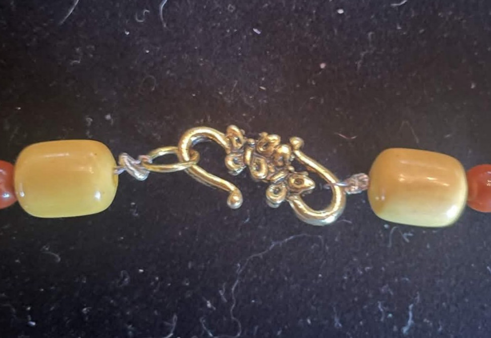 Yellow and Brown Beaded Necklace with Carved Wooden Pendant. 30 in. Gift box
