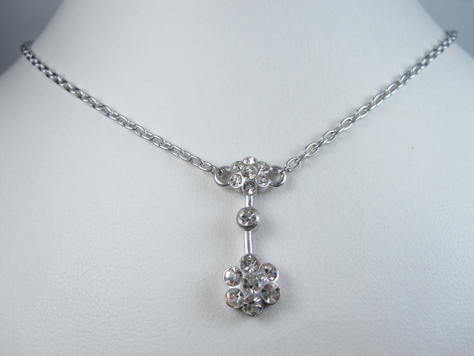 Nina Ricci Rhodium Plated Pendant with Swarovski Crystals – 16-18″ length 9380
