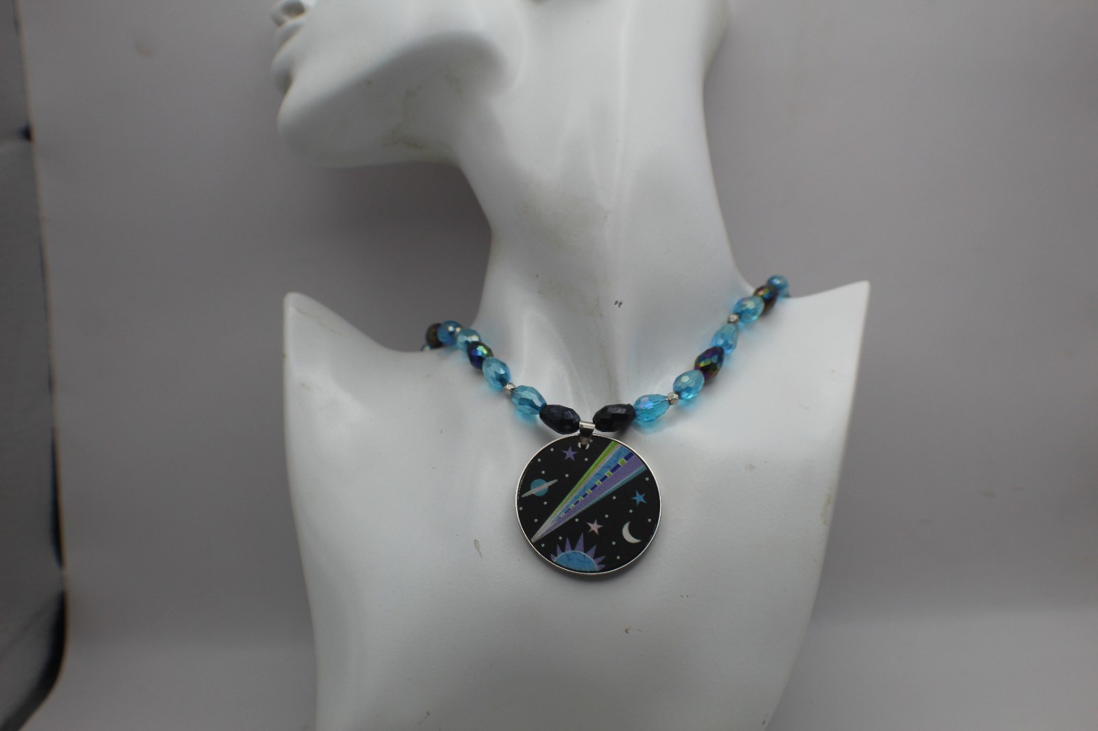 Space Pendant On A Beaded Necklace Black And Blue Beads