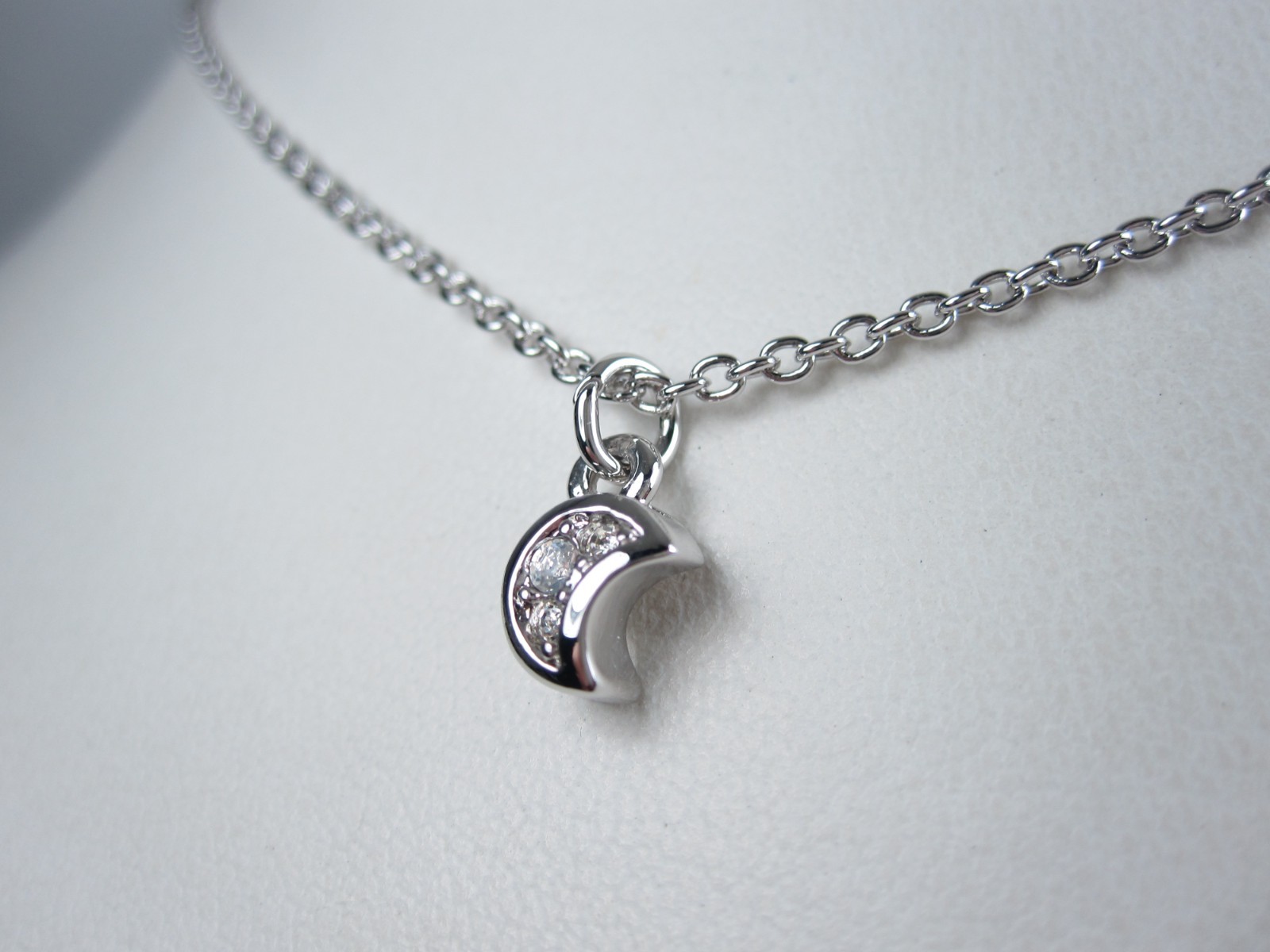Nina Ricci Rhodium Plated Pendant with Swarovski Crystals – 16-18″ length 9379