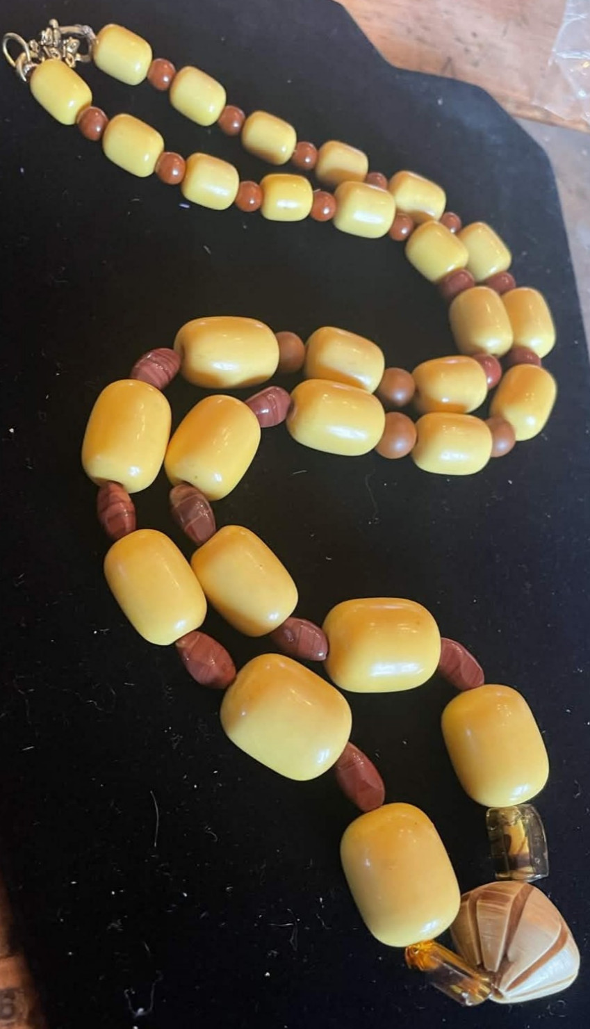 Yellow and Brown Beaded Necklace with Carved Wooden Pendant. 30 in. Gift box