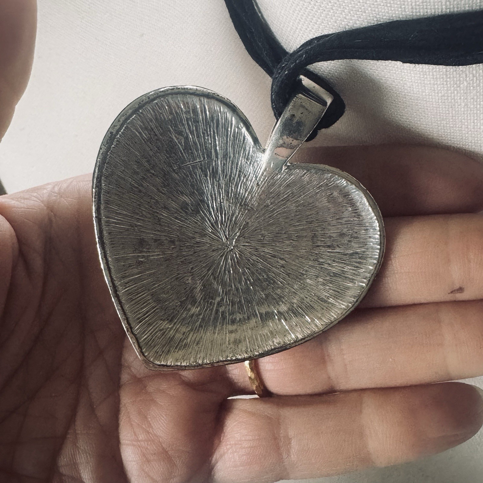 Modern silver tone pebbled heart pendant necklace on leather cording adjustable