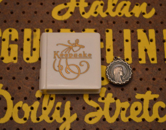 Small White and Gold Keepsake Jewelry Box with Silver Tone Religious Pendant