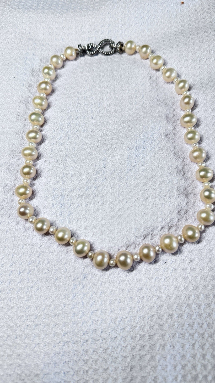 High-quality freshwater pearls with natural aurora luster. (11mm–12mm)