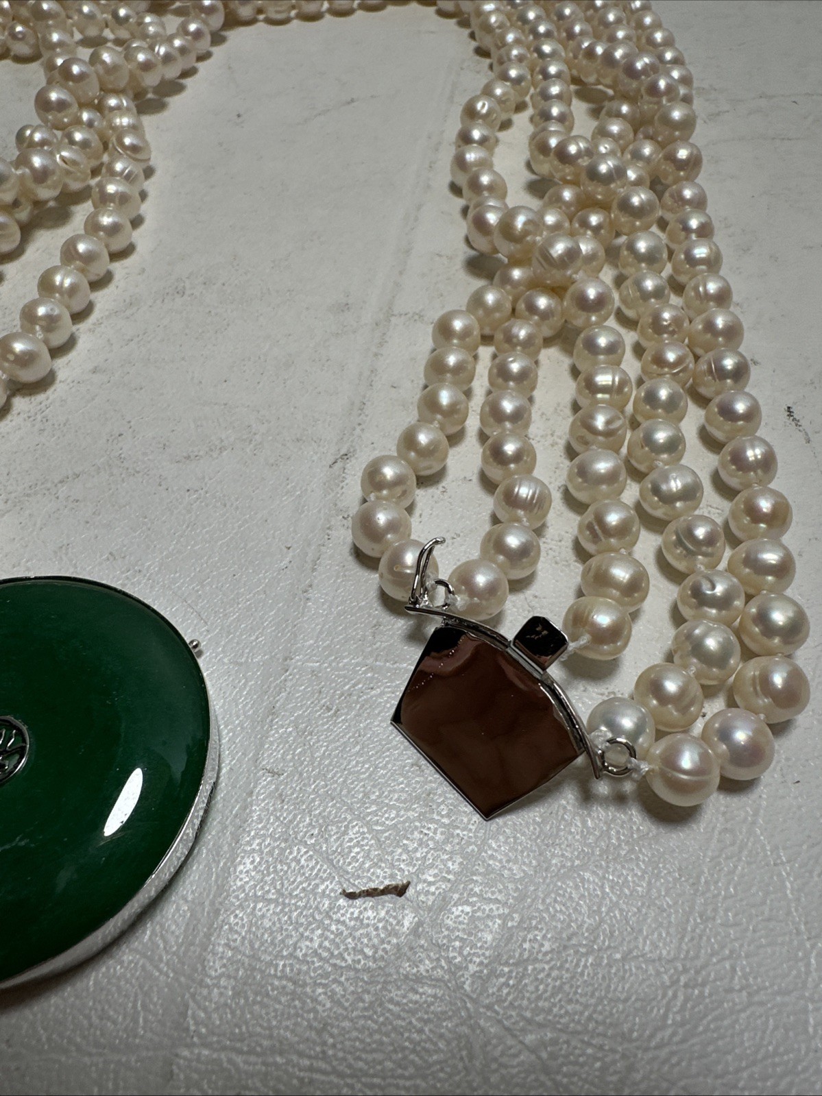 Chinese Natural Pearl Necklace, 925 Silver and a Green Stone In The Middle