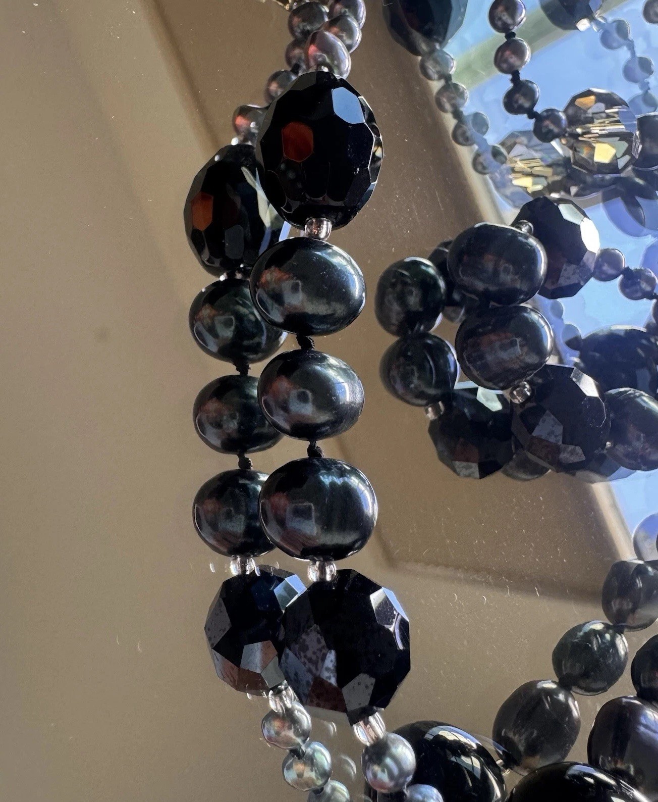 beautiful peacock pearl necklace with faceted gray and black beads