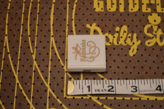 Small White and Gold Keepsake Jewelry Box with Silver Tone Religious Pendant