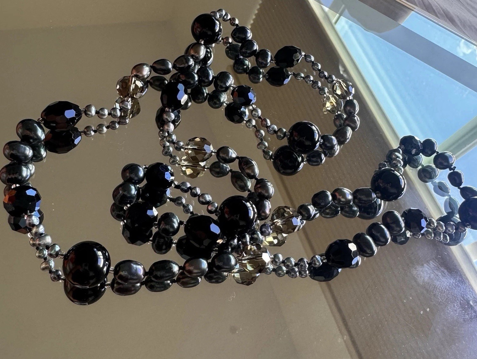 beautiful peacock pearl necklace with faceted gray and black beads
