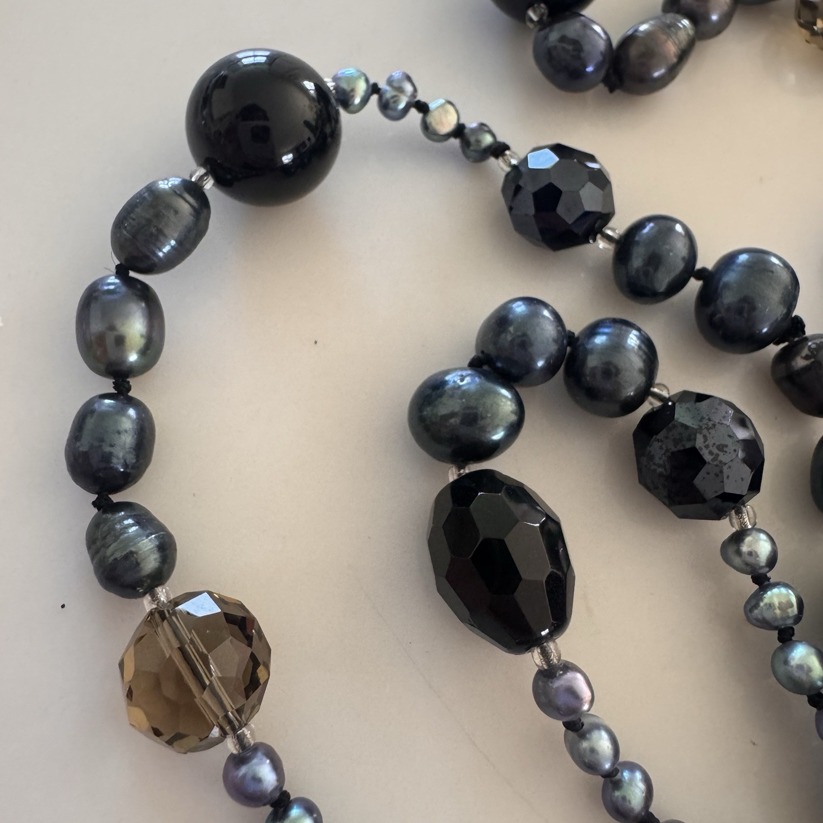 beautiful peacock pearl necklace with faceted gray and black beads