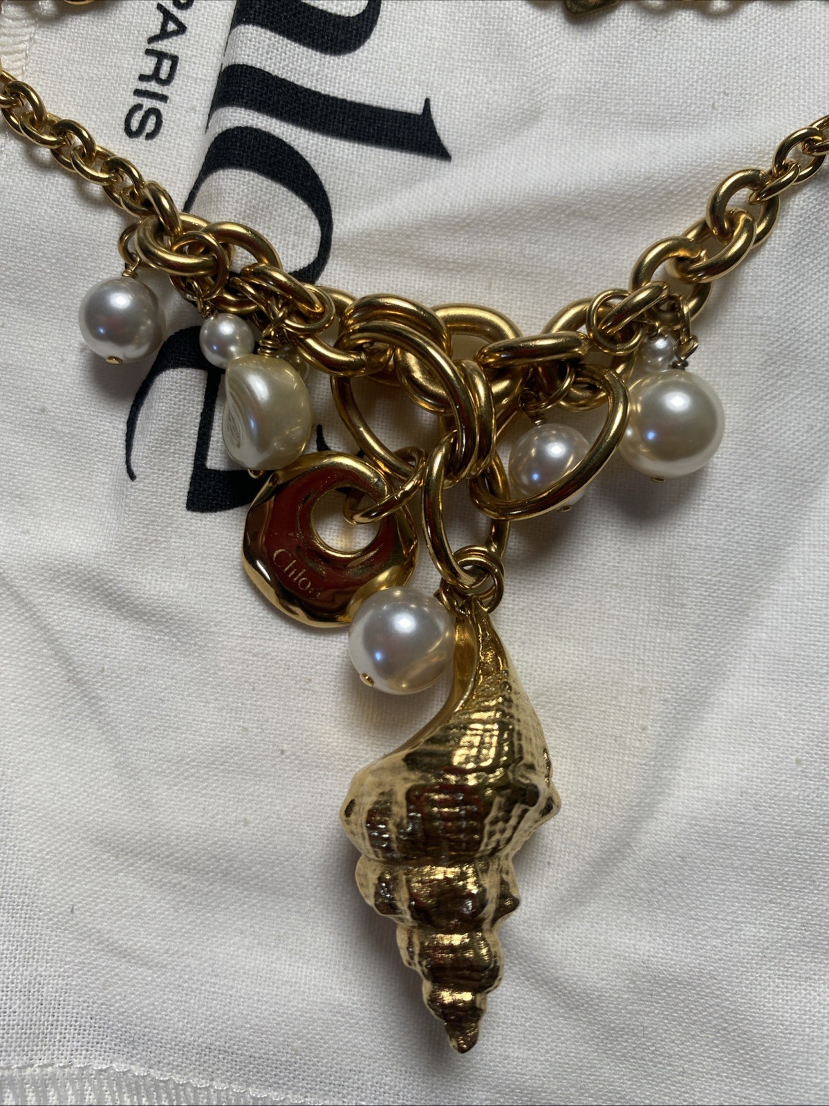 Chloe Shell pearl charm Gold Stone Designer Collection