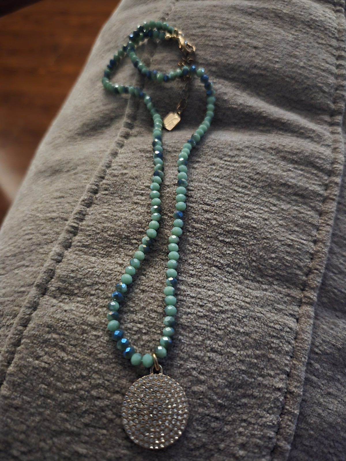 Beaded Necklace In Turquoise Color With Crystal Charm Set In Gold