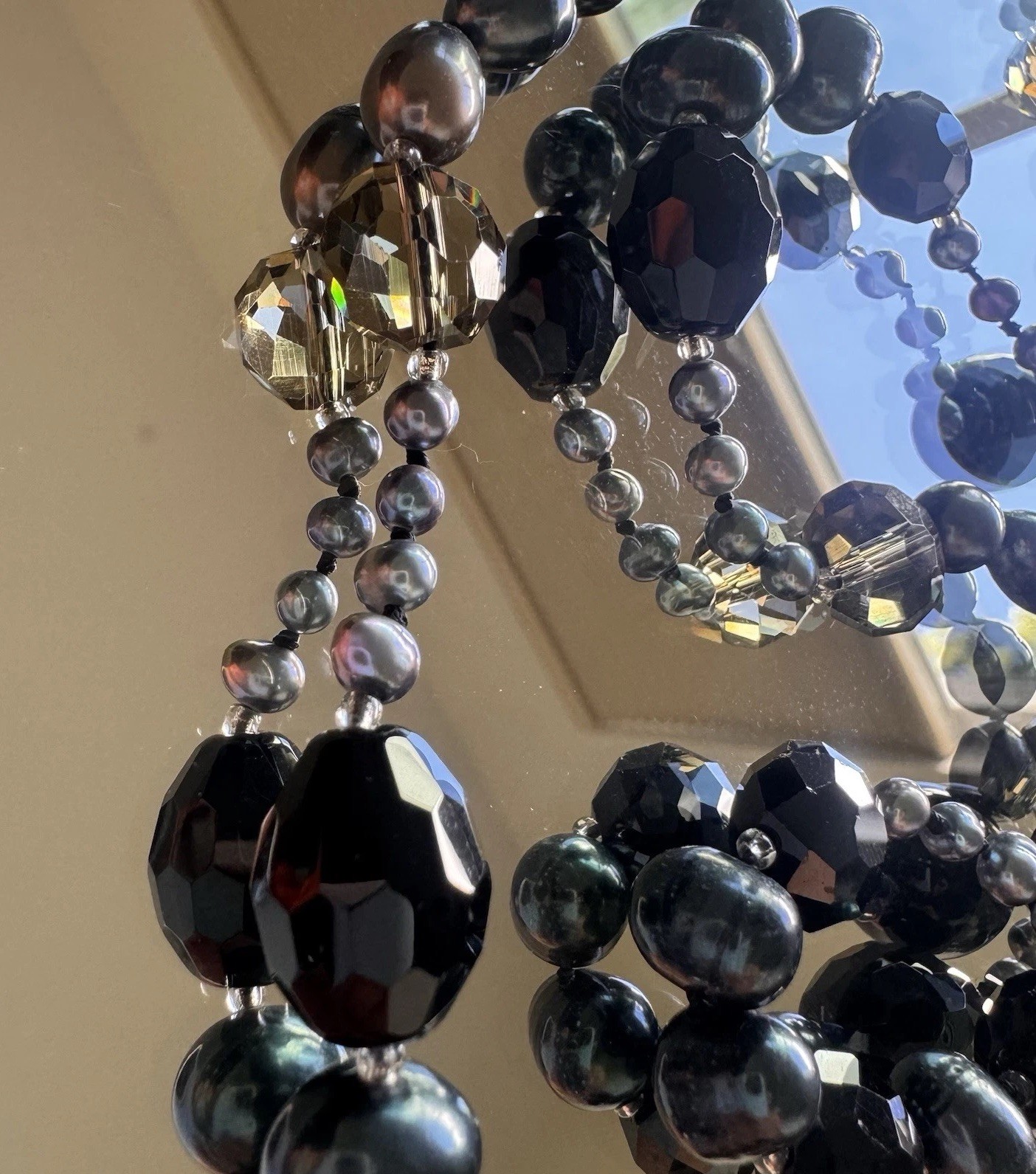 beautiful peacock pearl necklace with faceted gray and black beads