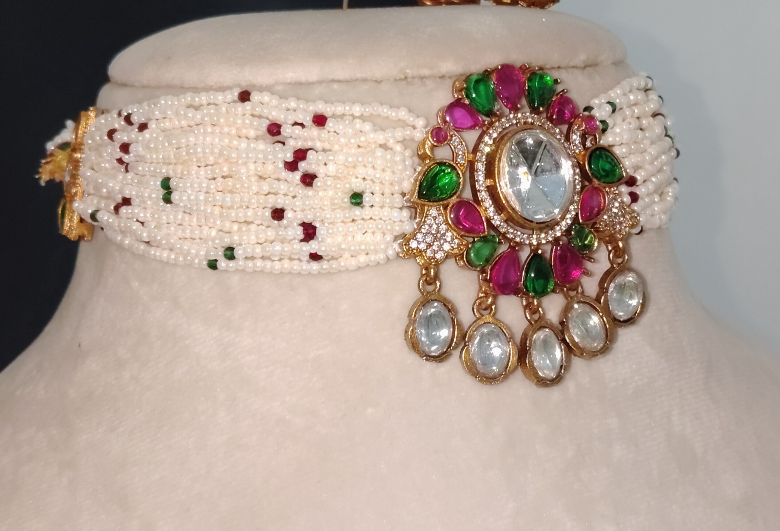 Dana Emerald Ruby Studded Multi Strand Pearl Kundan Choker Set Roz Jewellers.