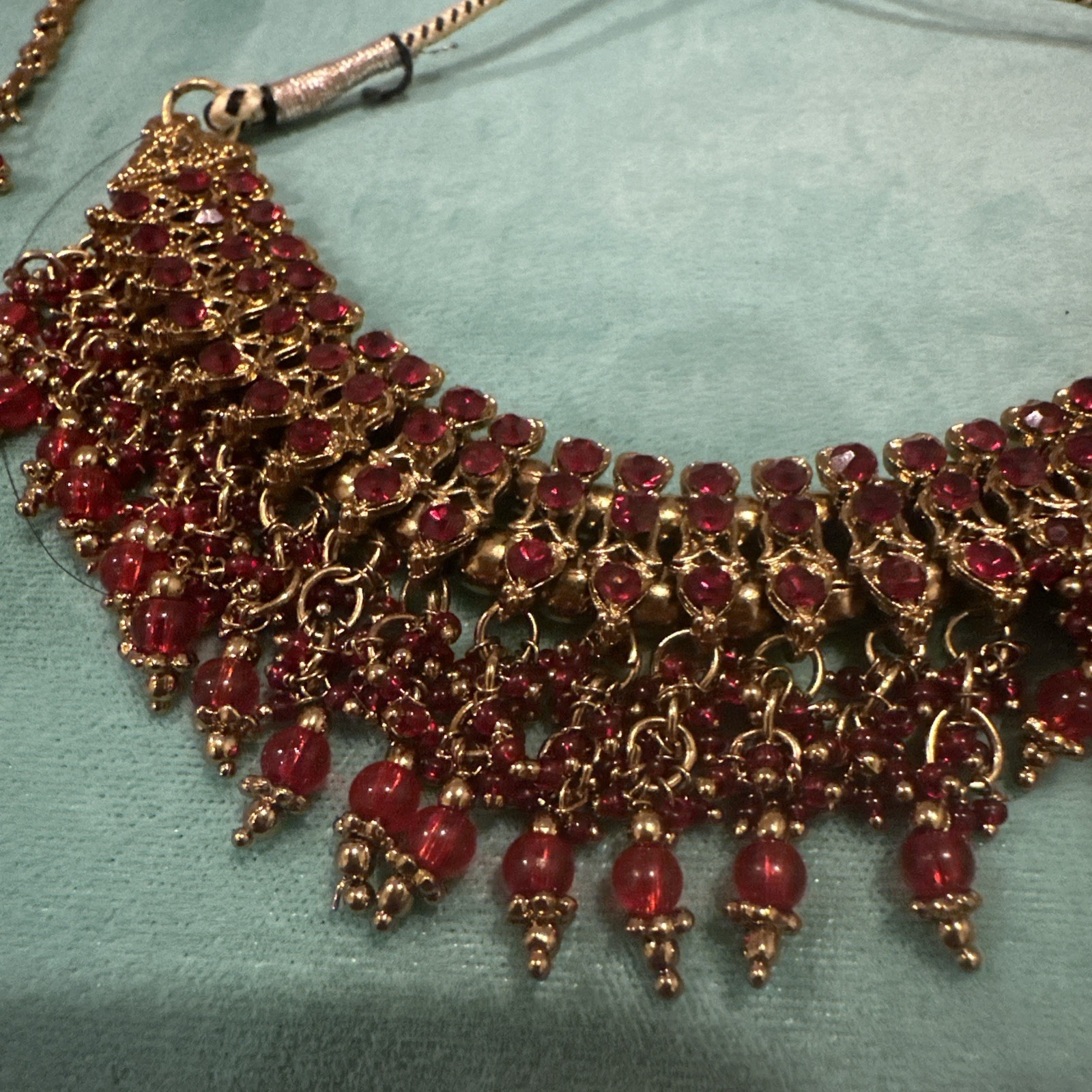 Fashion Jewelry Maroon Necklace With Jhumkas With Hair Attachment In Gold Tone