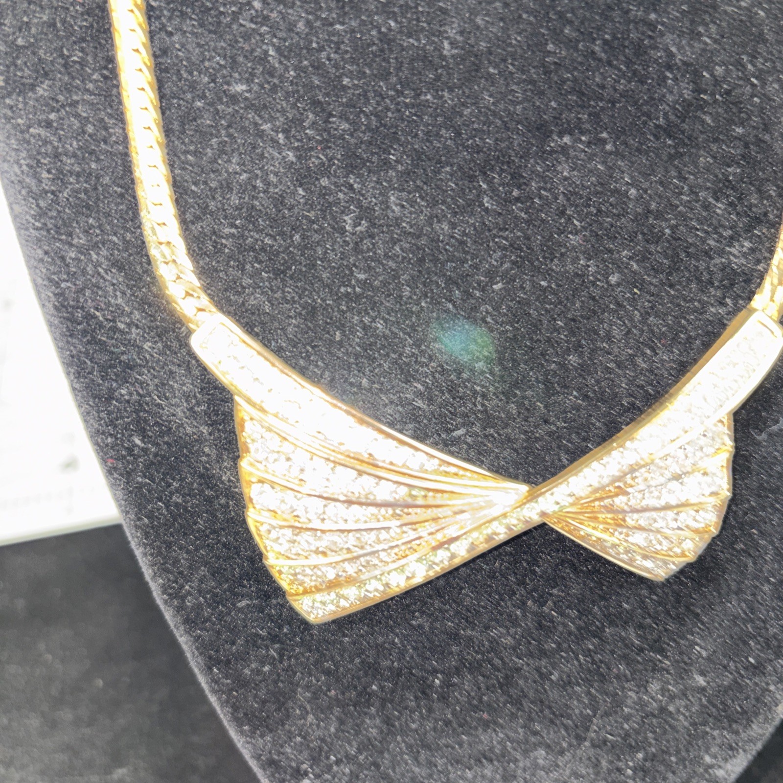 Beautiful Nina Ricci Pave Set Rhinestone Bow Tie Necklace in Goldtone