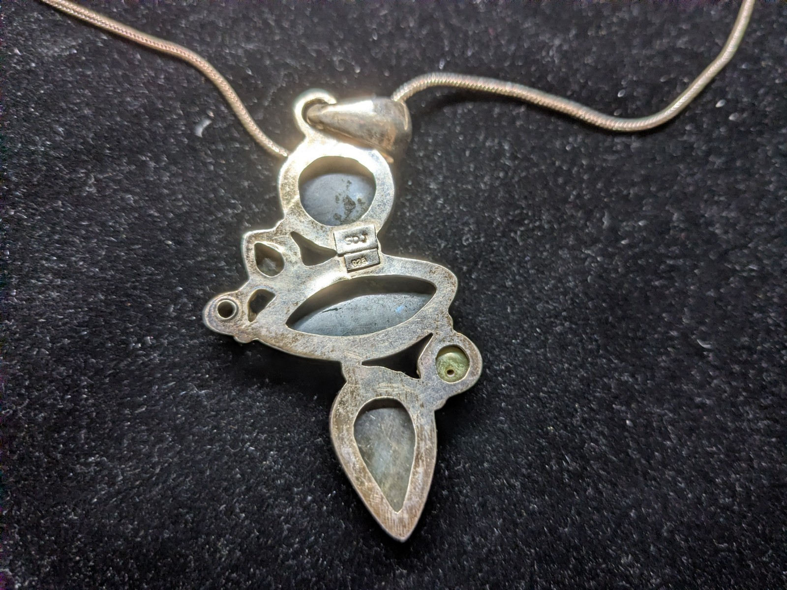A Multi-stone cluster statement pendant necklace
