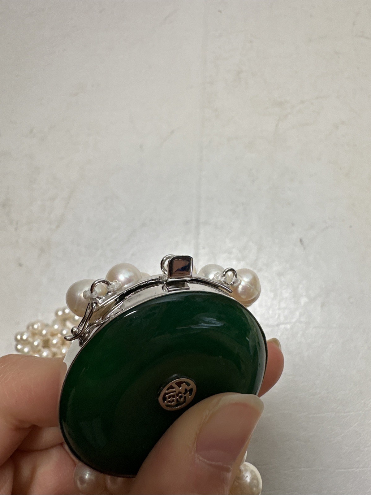 Chinese Natural Pearl Necklace, 925 Silver and a Green Stone In The Middle