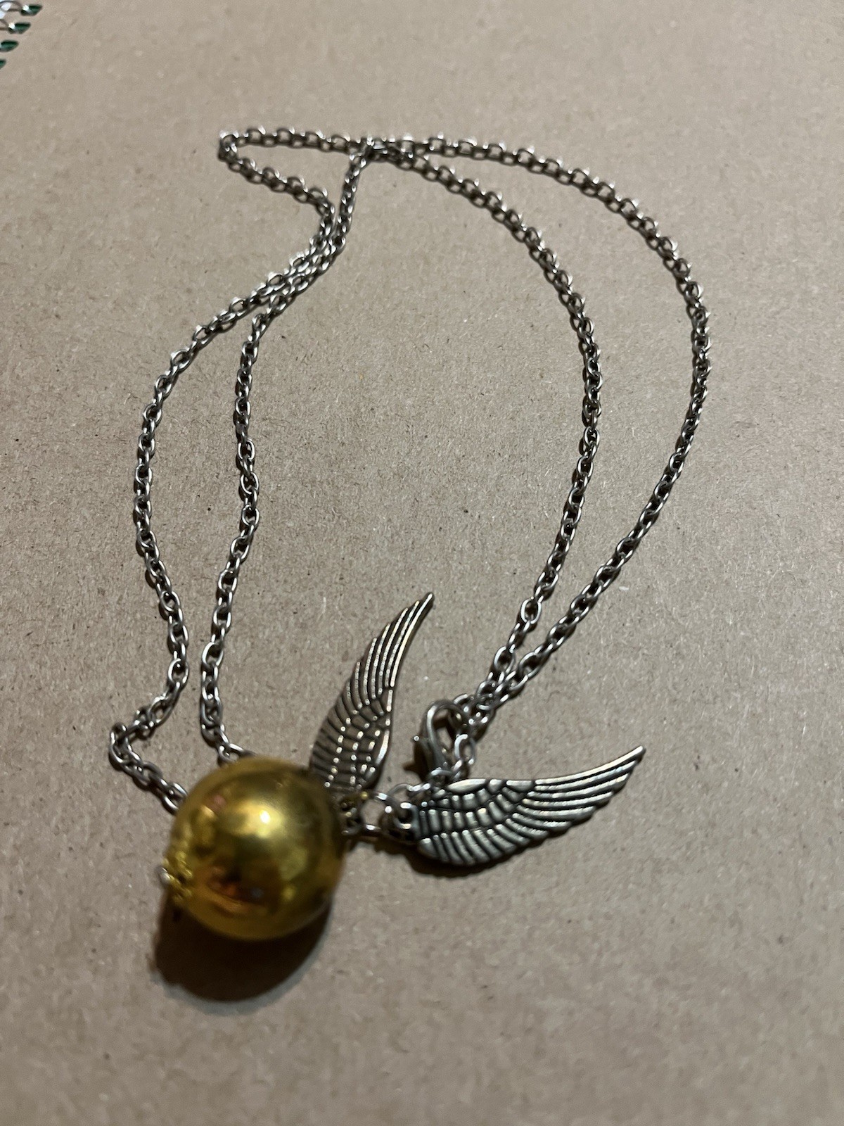 Harry Potter Guardian golden snitch w/ gold tone sphere