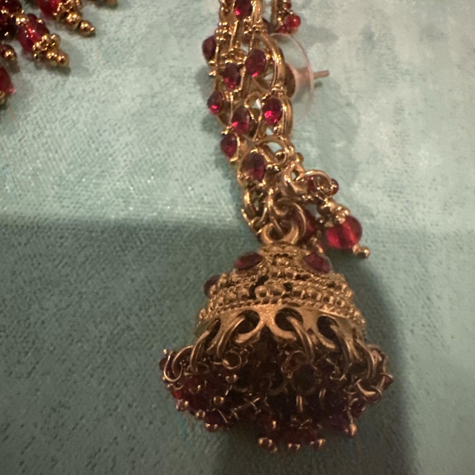 Fashion Jewelry Maroon Necklace With Jhumkas With Hair Attachment In Gold Tone