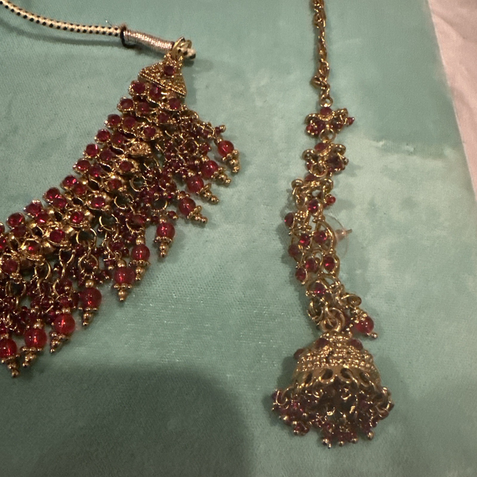 Fashion Jewelry Maroon Necklace With Jhumkas With Hair Attachment In Gold Tone