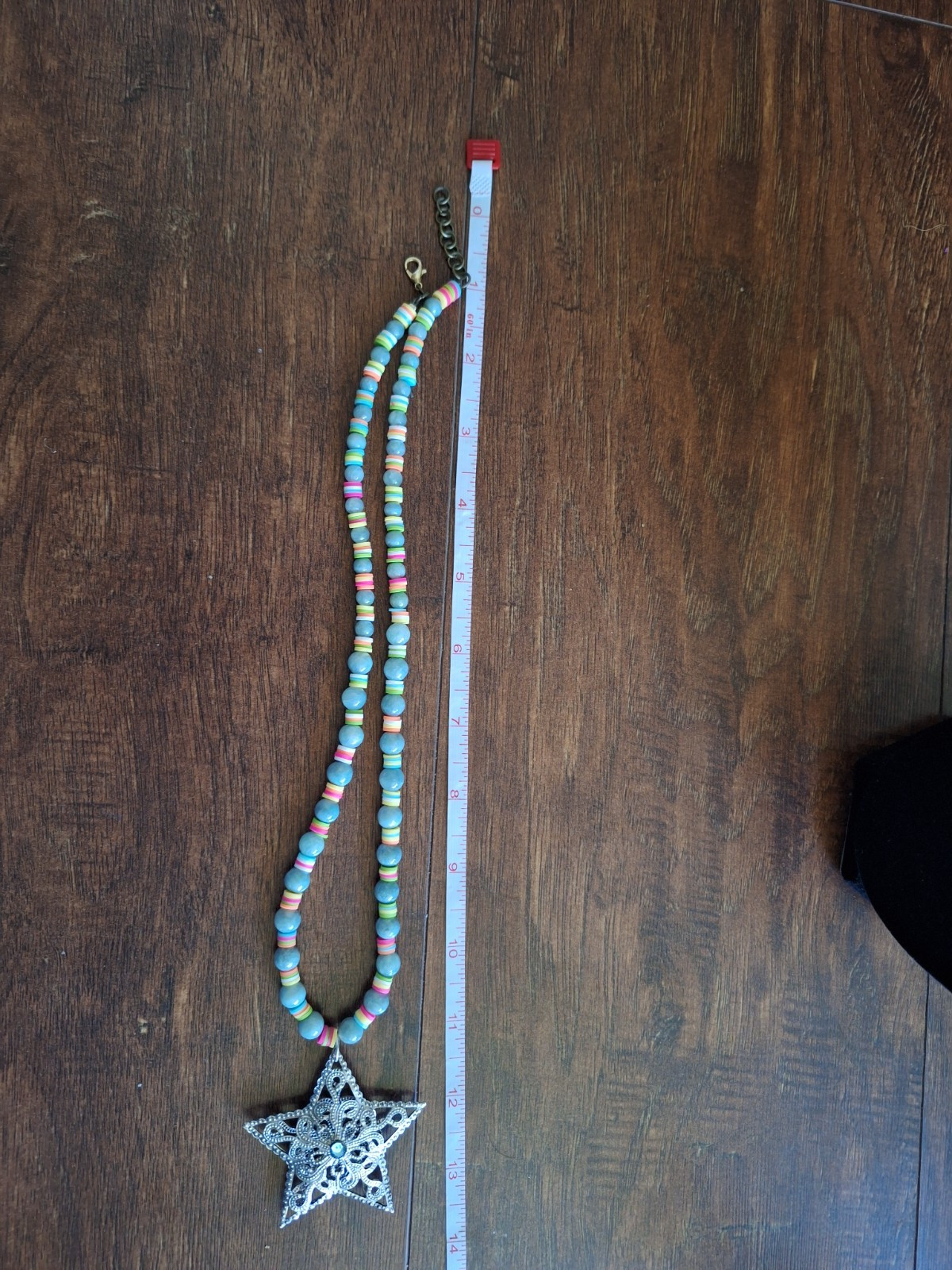 14 inch necklace with a star and multicolored and blue grey beads