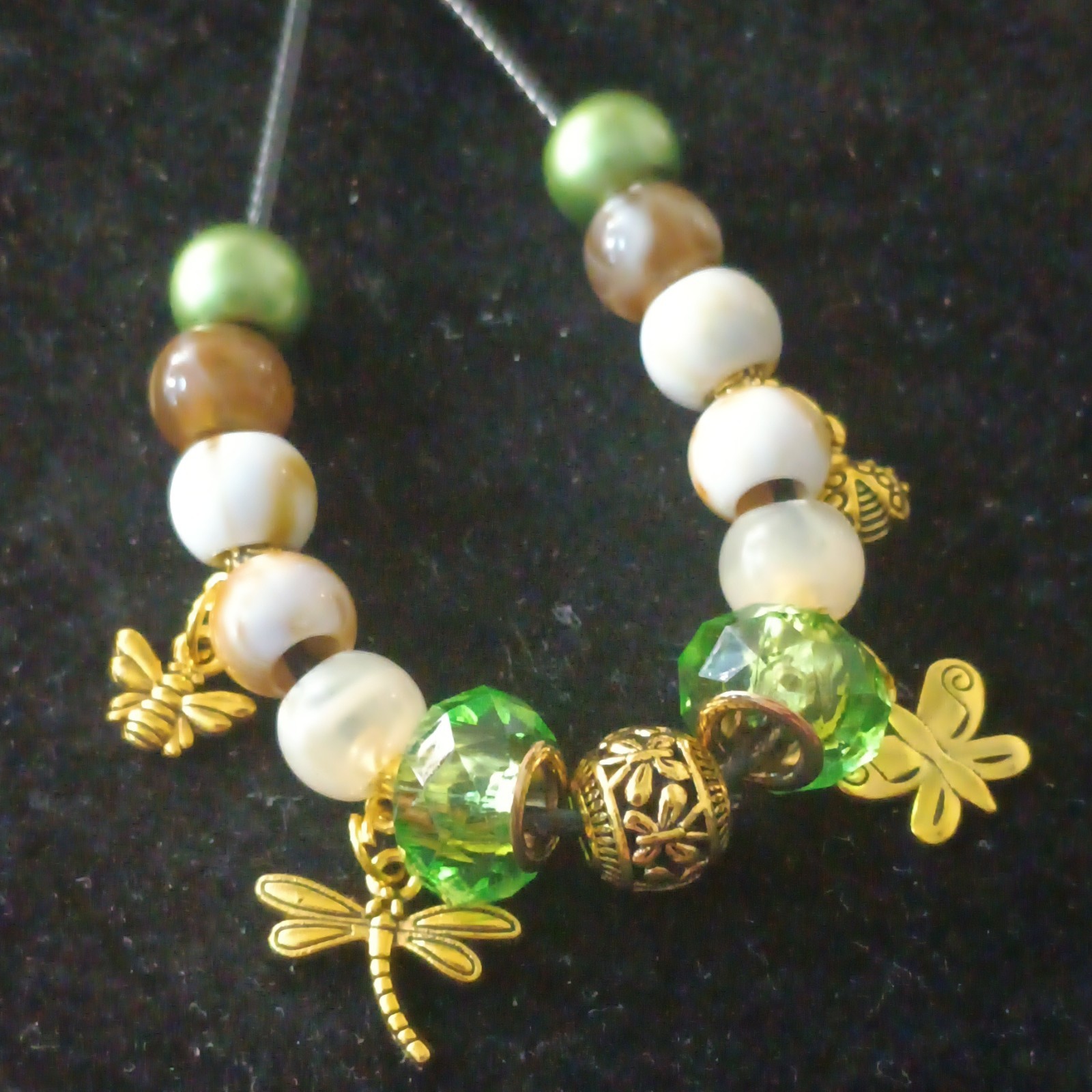 Green, Brown, & White Beaded Cord Necklace With Gold-Tone Insect Charms