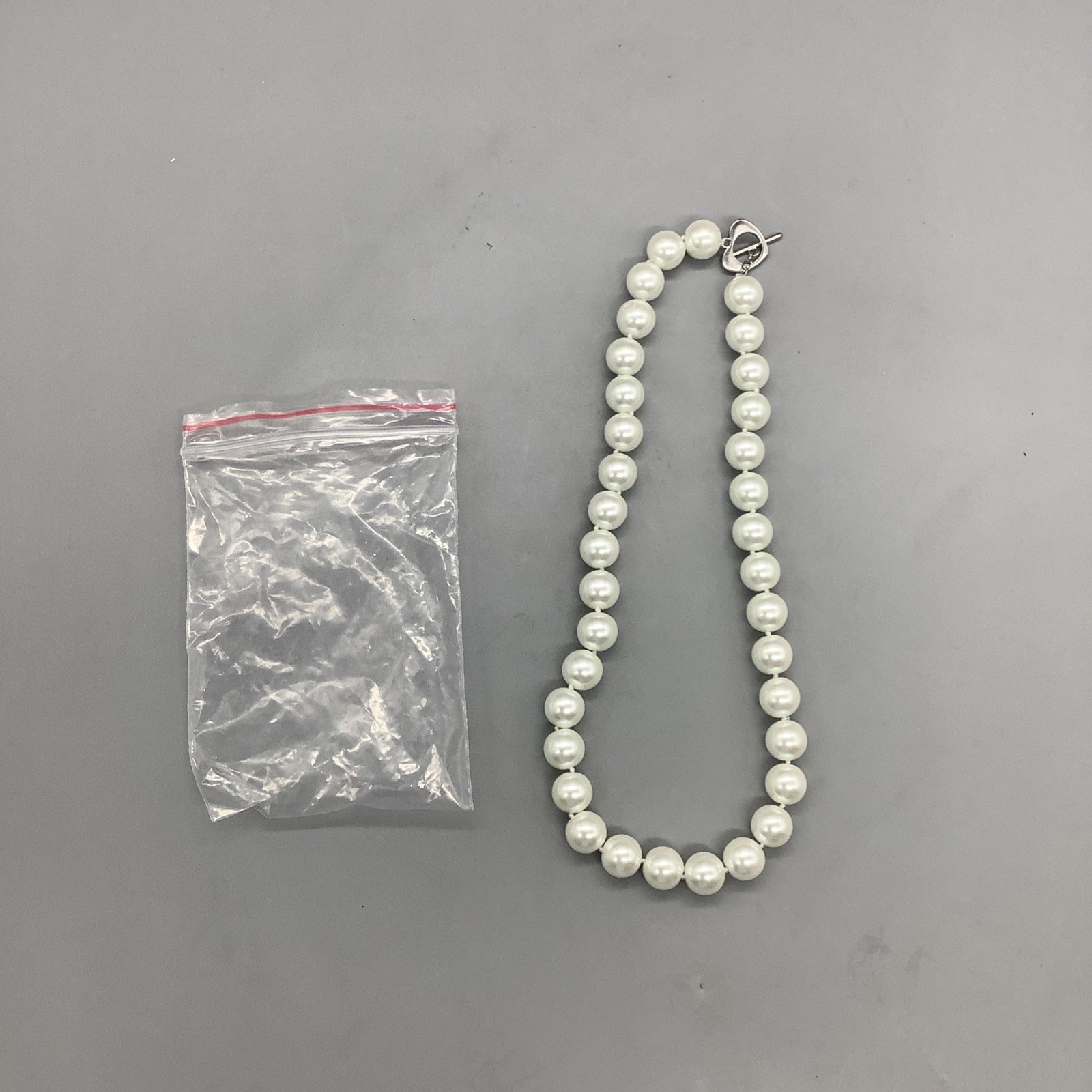 Medium Sized Pearls/Pearl Necklace w/ Heart Shaped Clasp That Connects w/ Bar