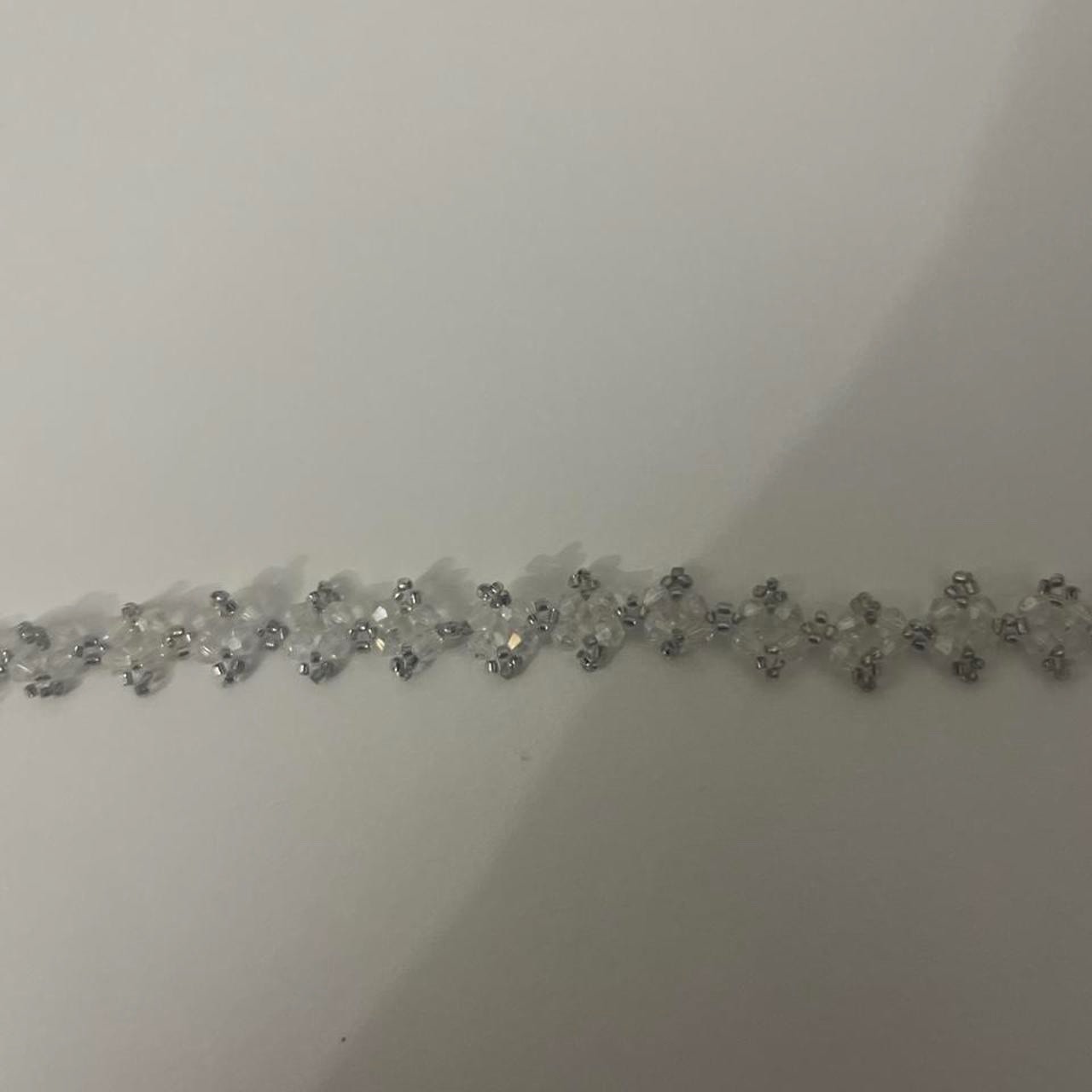 Pack of chocker necklaces: -white daisy flowers (cloth chocker) -clear beaded
