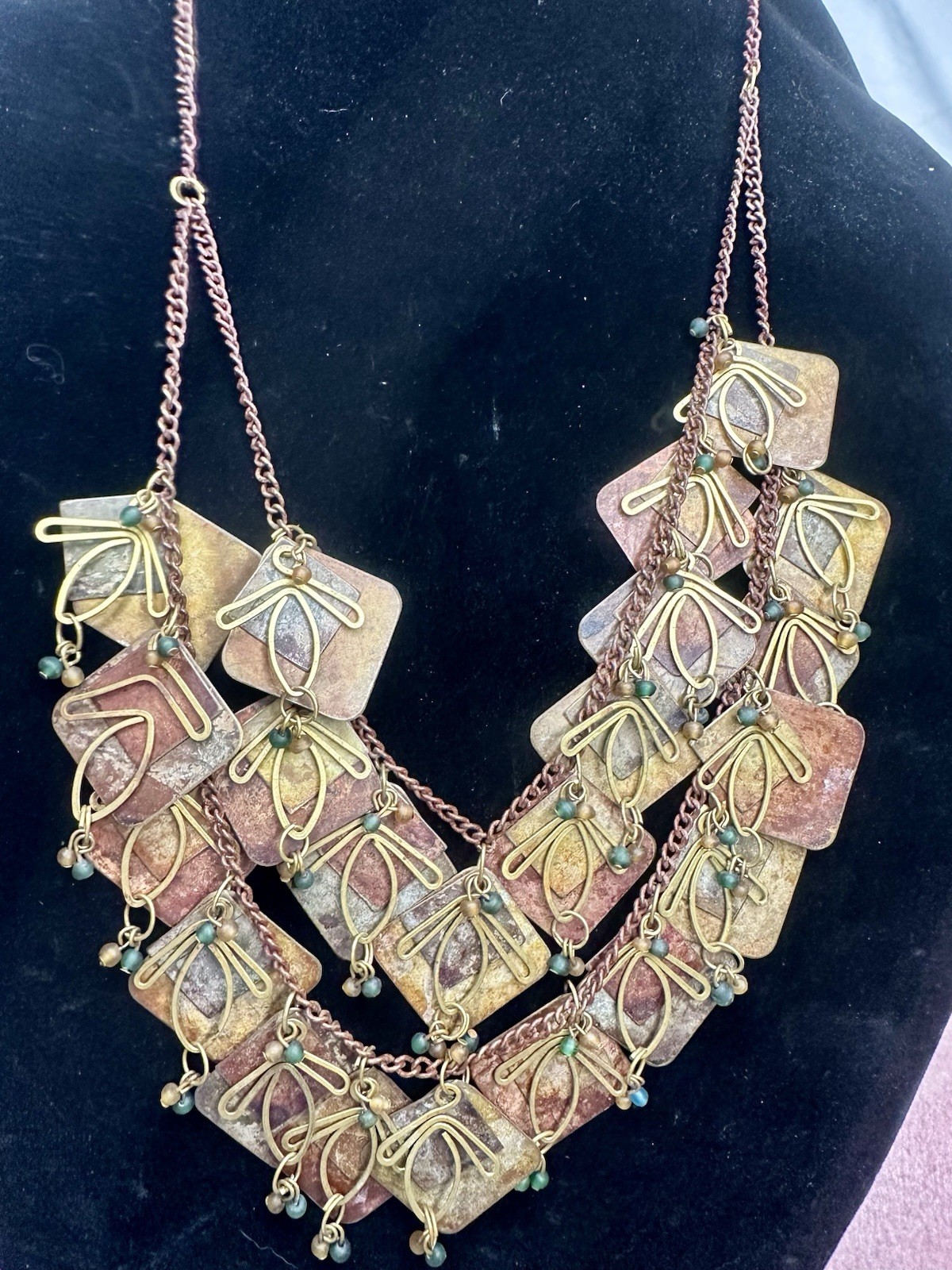 Vintage Metal Artisan Chain with Multi tiered Metal Patina Panels And Charms