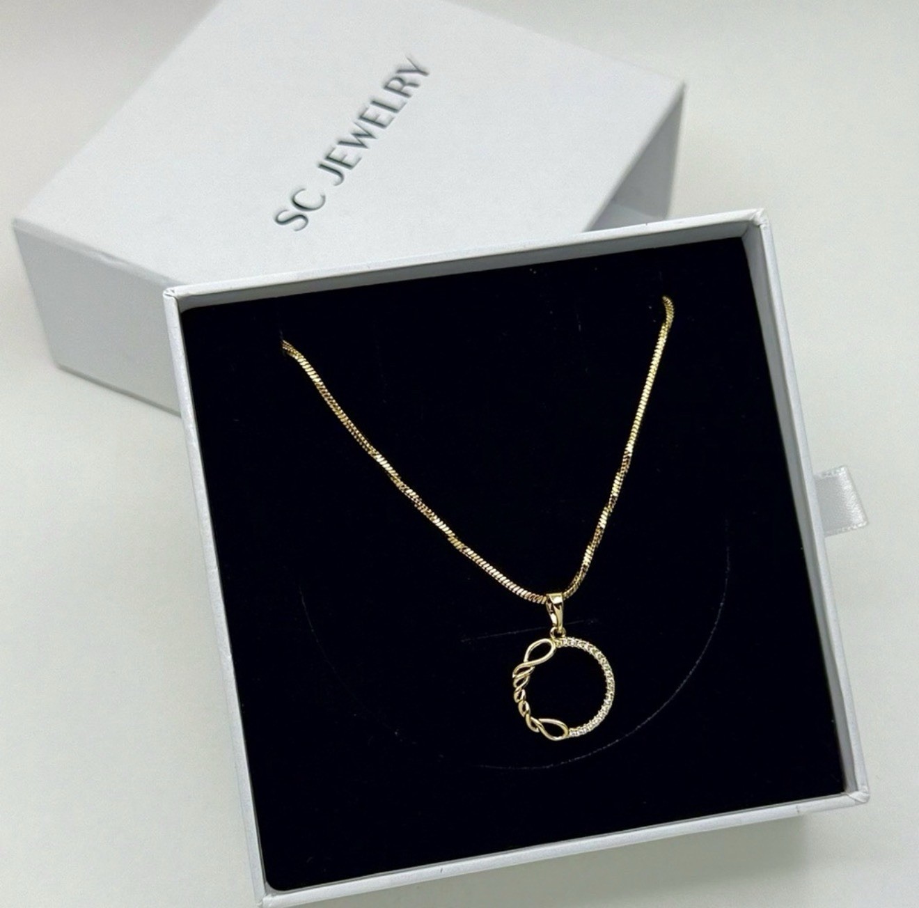 Gold Plated Twisted Circle Pendant Necklace – Pavé Crystal Infinity Round Charm