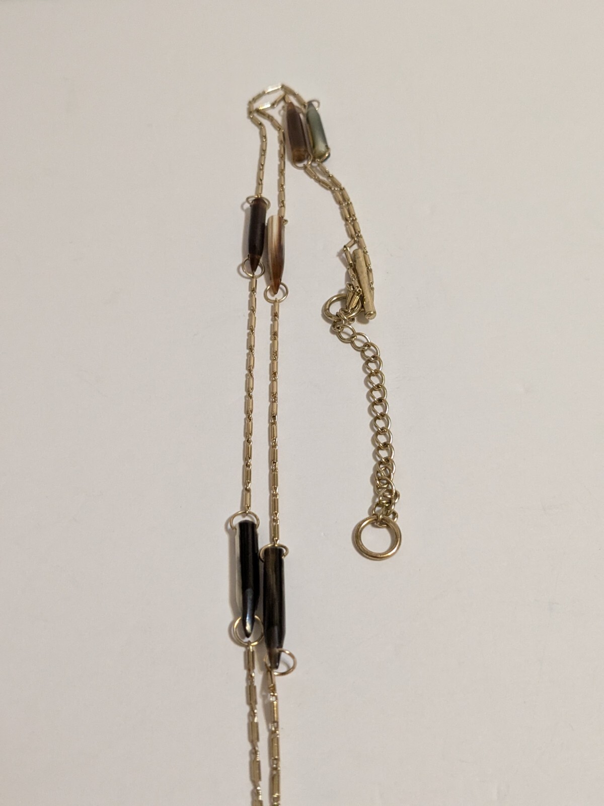 Gold Tone Y Drop Necklace With Acrylic Spear Shaped Beads. 28″ + 6.25″ Drop.