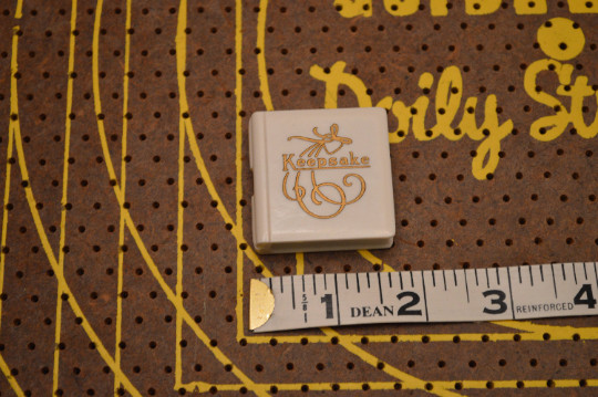 Small White and Gold Keepsake Jewelry Box with Silver Tone Religious Pendant
