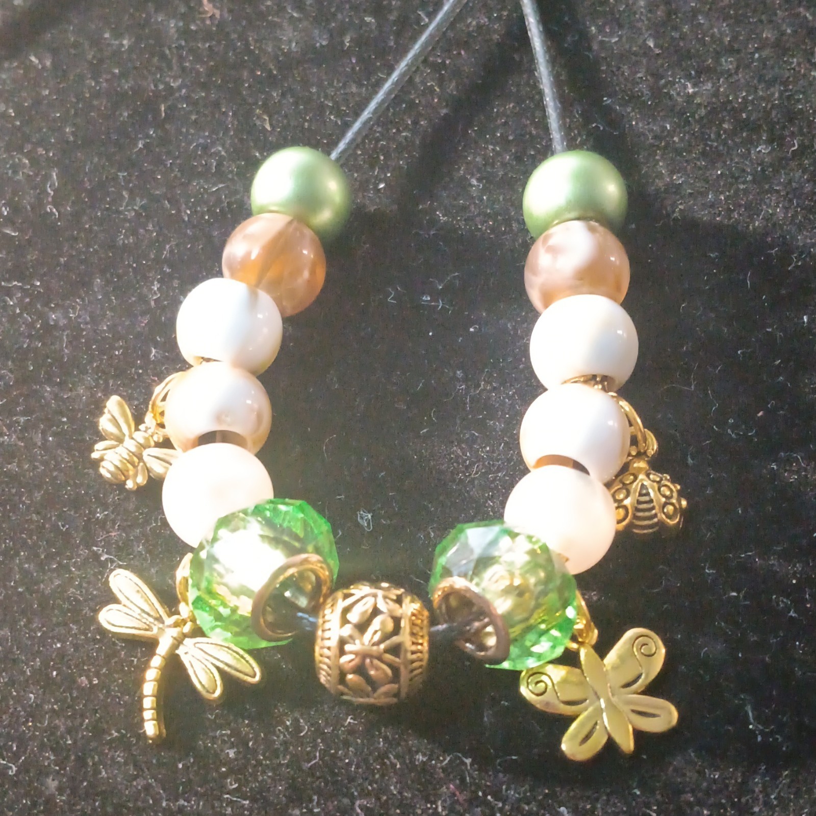 Green, Brown, & White Beaded Cord Necklace With Gold-Tone Insect Charms