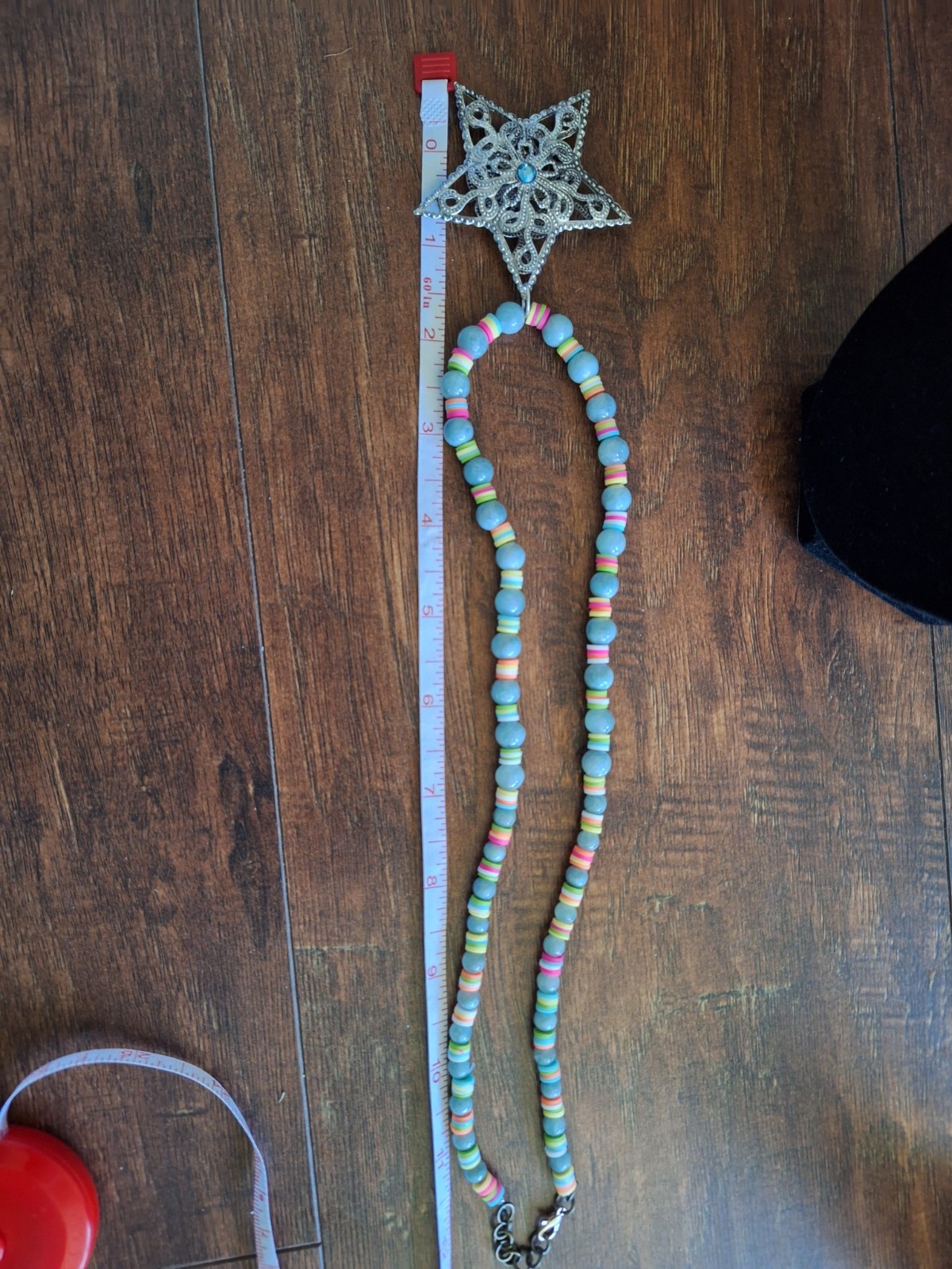 14 inch necklace with a star and multicolored and blue grey beads