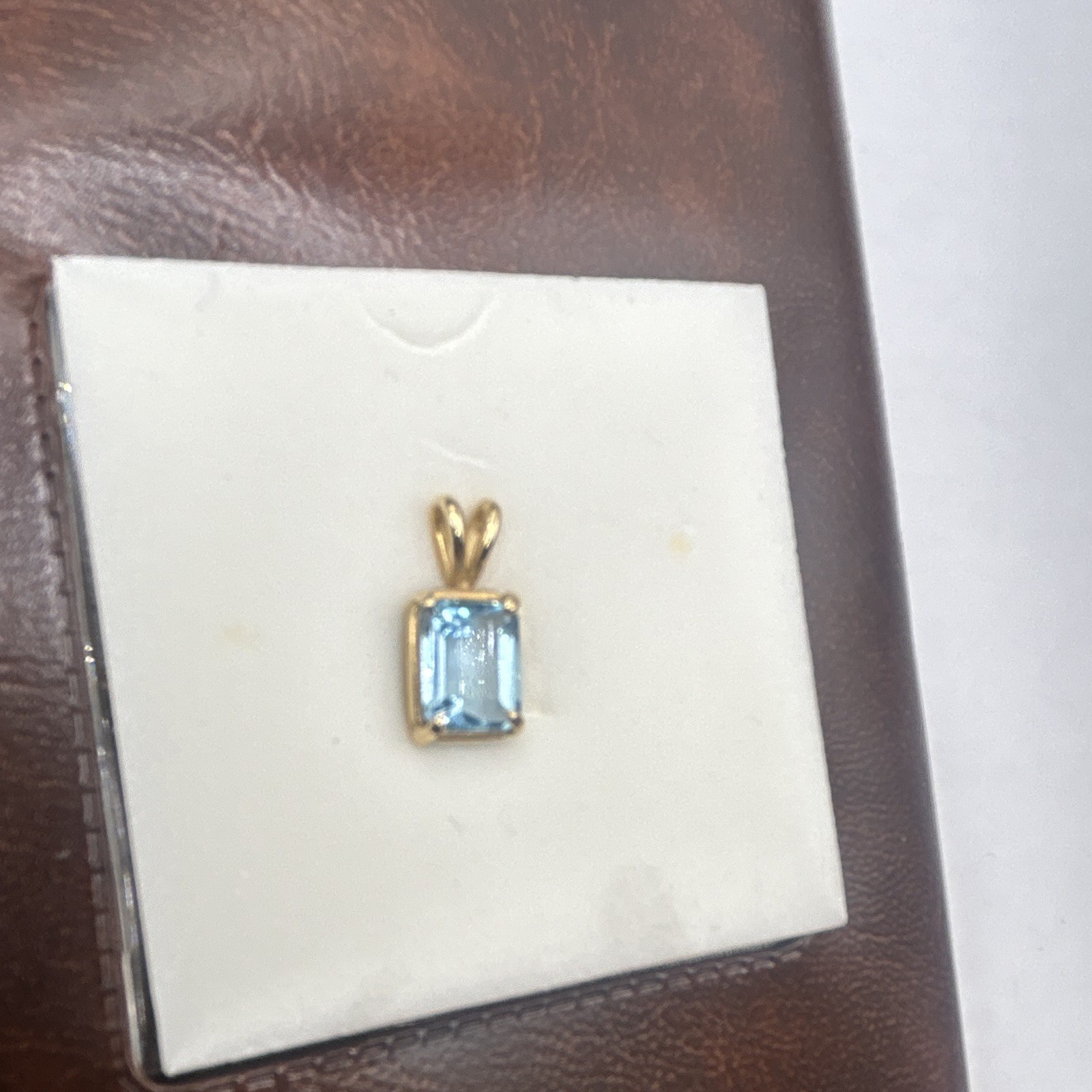 Genuine blue topaz emerald cut stone pendant, 14k gold frame