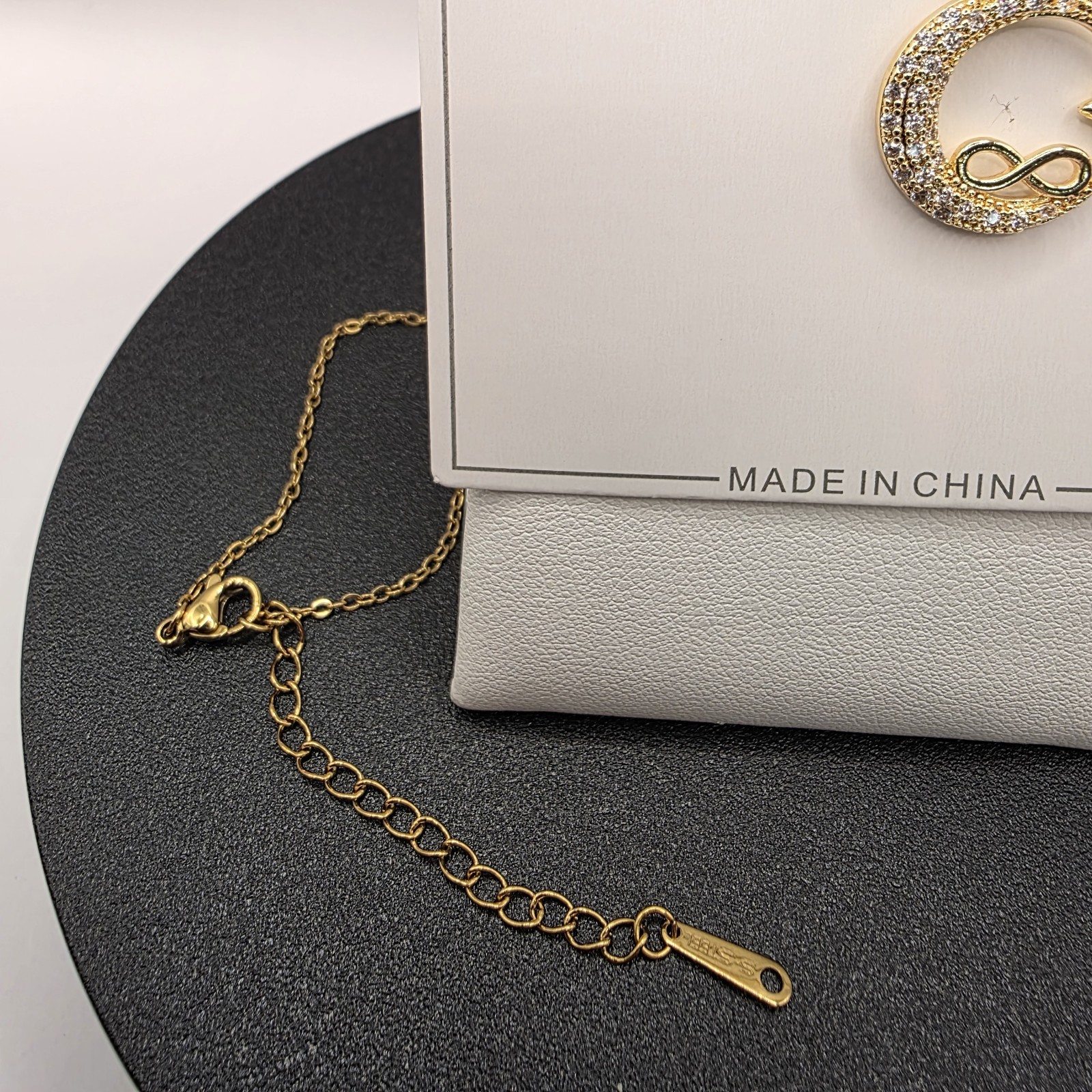 Stainless Steel Copper Plated 16″Necklace w/19mm CZ Moon, Star & Infinity…