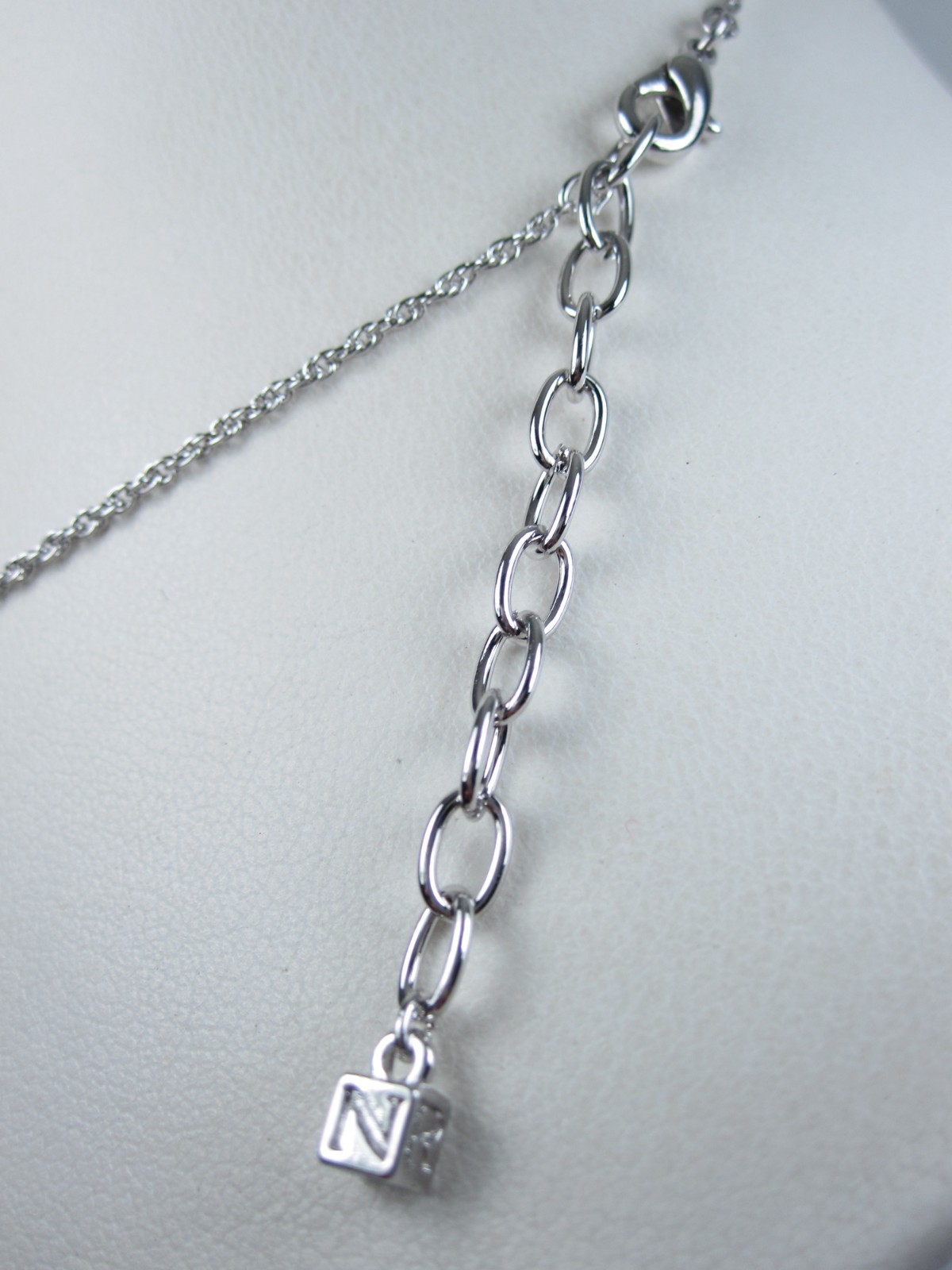 Nina Ricci Rhodium Plated Pendant with Swarovski Crystals – 16-18″ length 9378