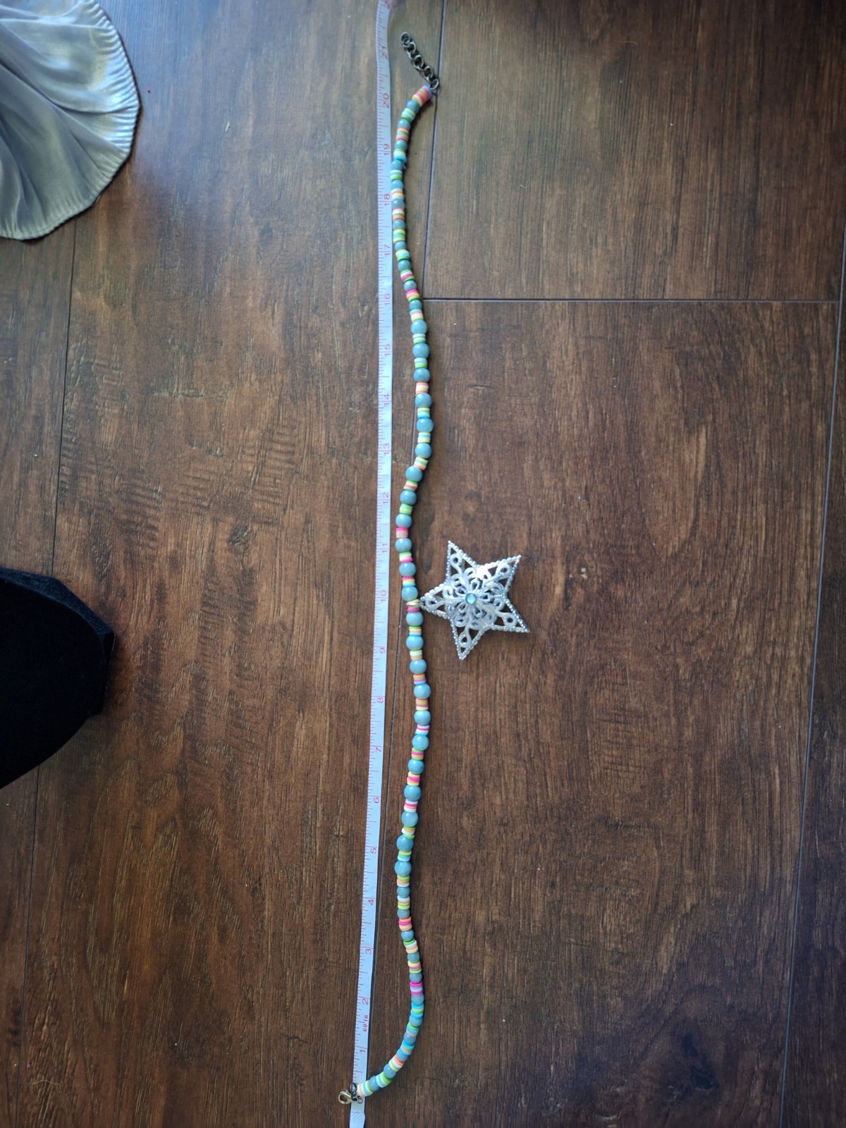 14 inch necklace with a star and multicolored and blue grey beads