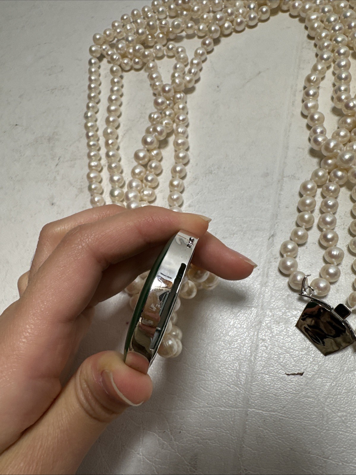 Chinese Natural Pearl Necklace, 925 Silver and a Green Stone In The Middle