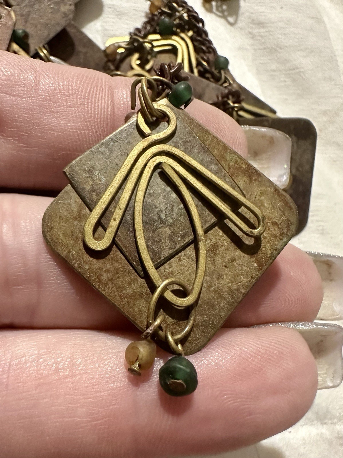 Vintage Metal Artisan Chain with Multi tiered Metal Patina Panels And Charms