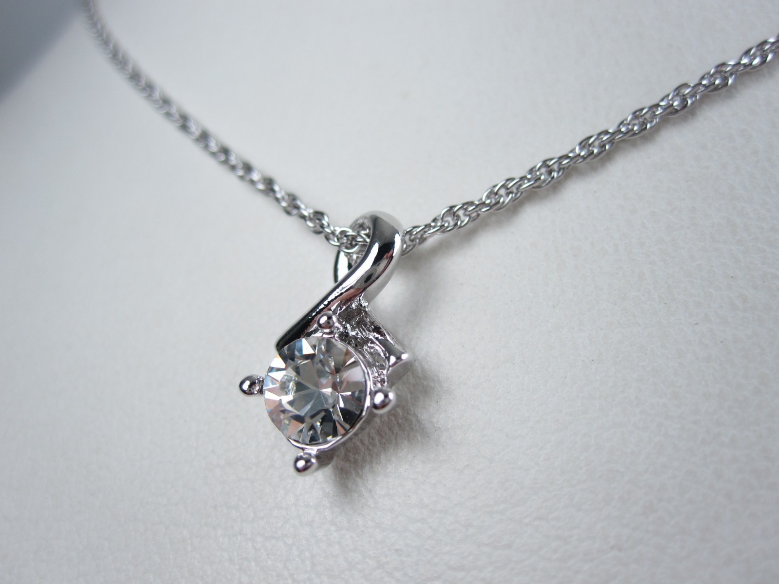 Nina Ricci Rhodium Plated Pendant with Swarovski Crystals – 16-18″ length 9378