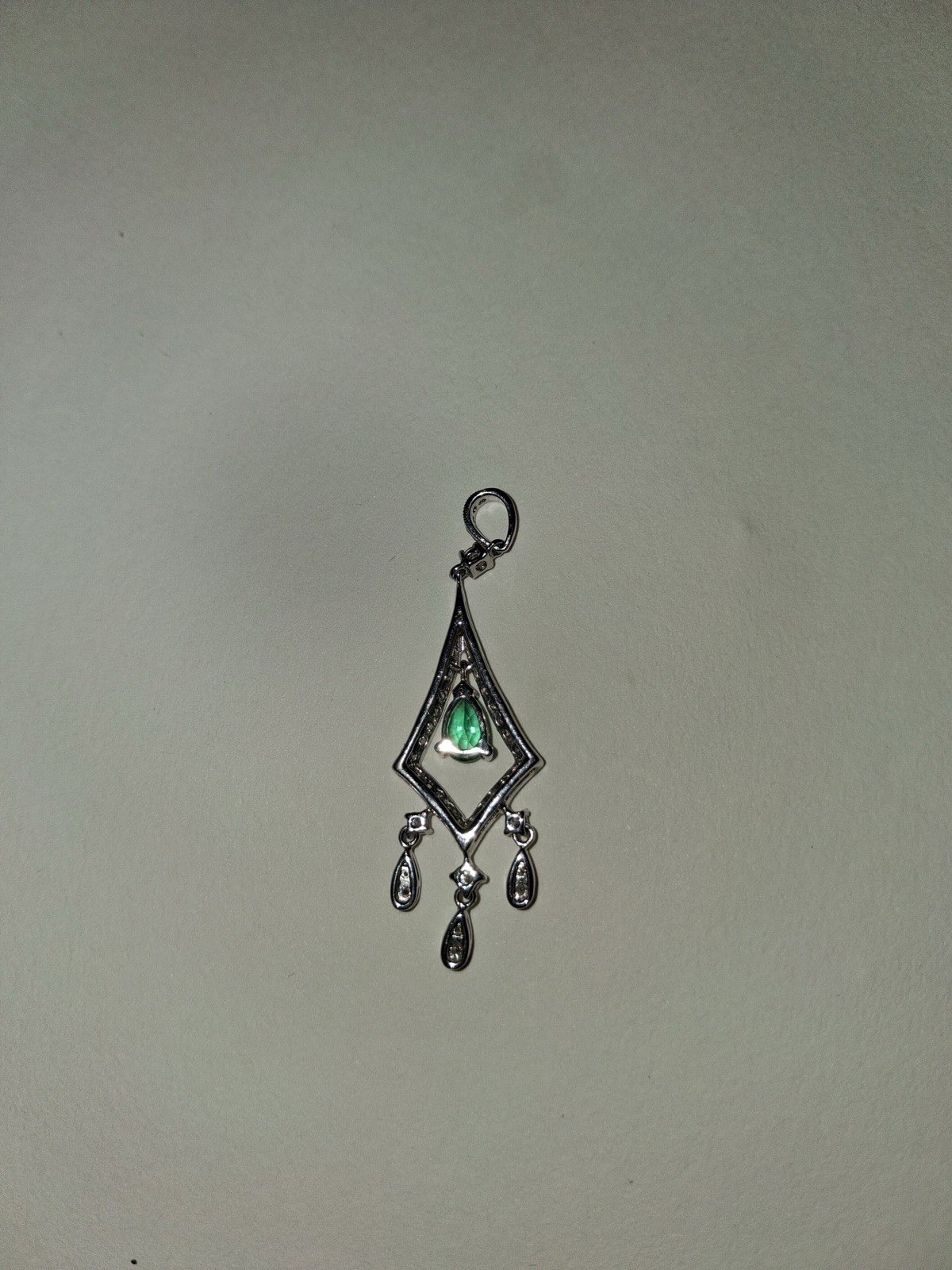 WHITE 18 KARAT/ ONE 0.36CT PEAR EMERALD 54=0.50TW ROUND H/I SI2 DIAMONDS