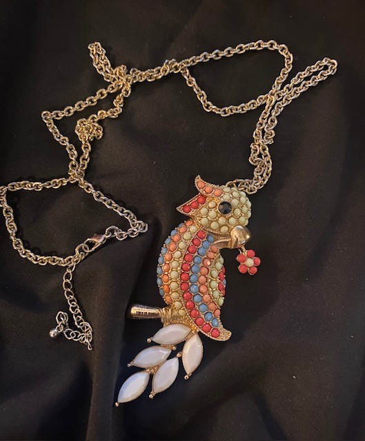 Gold-tone, multi-colored enamel and rhinestone parrot pendant necklace.