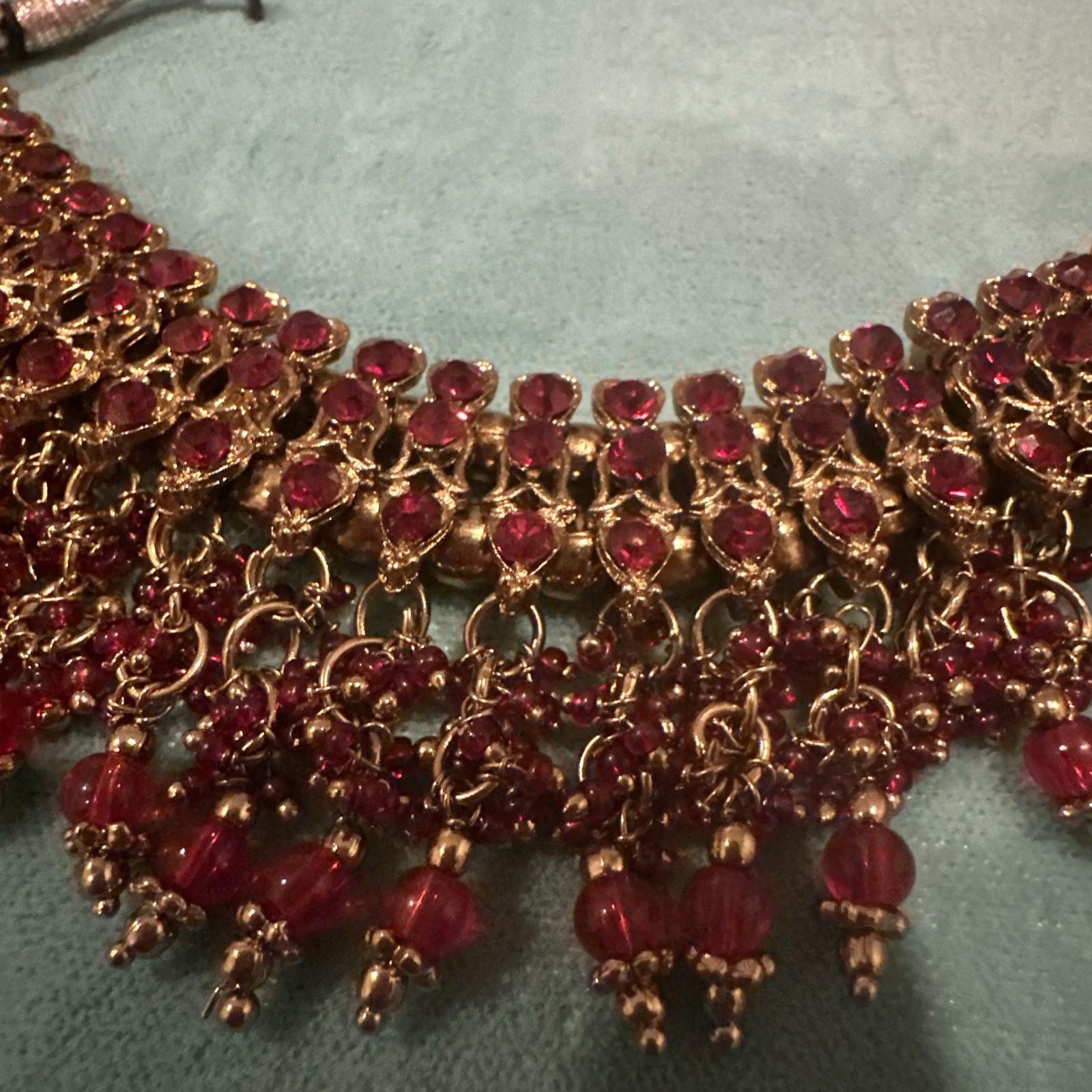 Fashion Jewelry Maroon Necklace With Jhumkas With Hair Attachment In Gold Tone