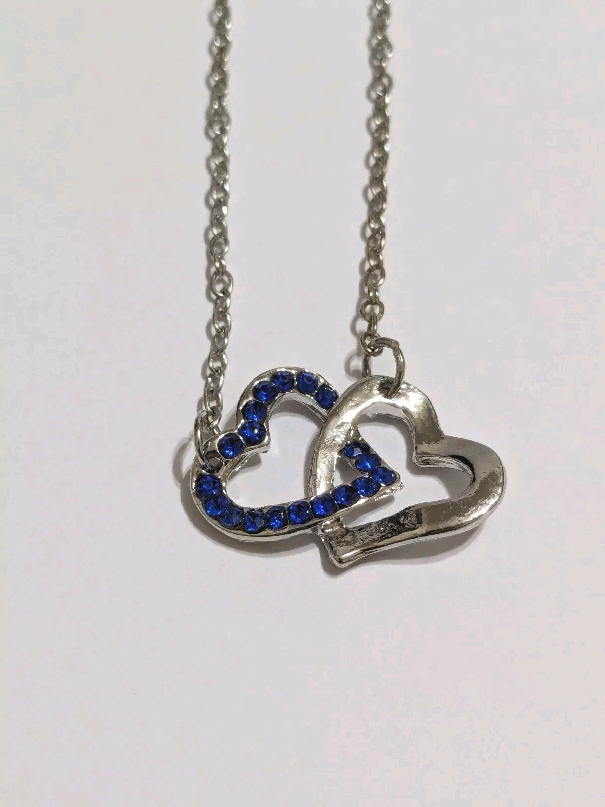 Interlinked Hearts Blue Rhinestones & Silver Tone Pendant Necklace. 16″. 2″ Ext.