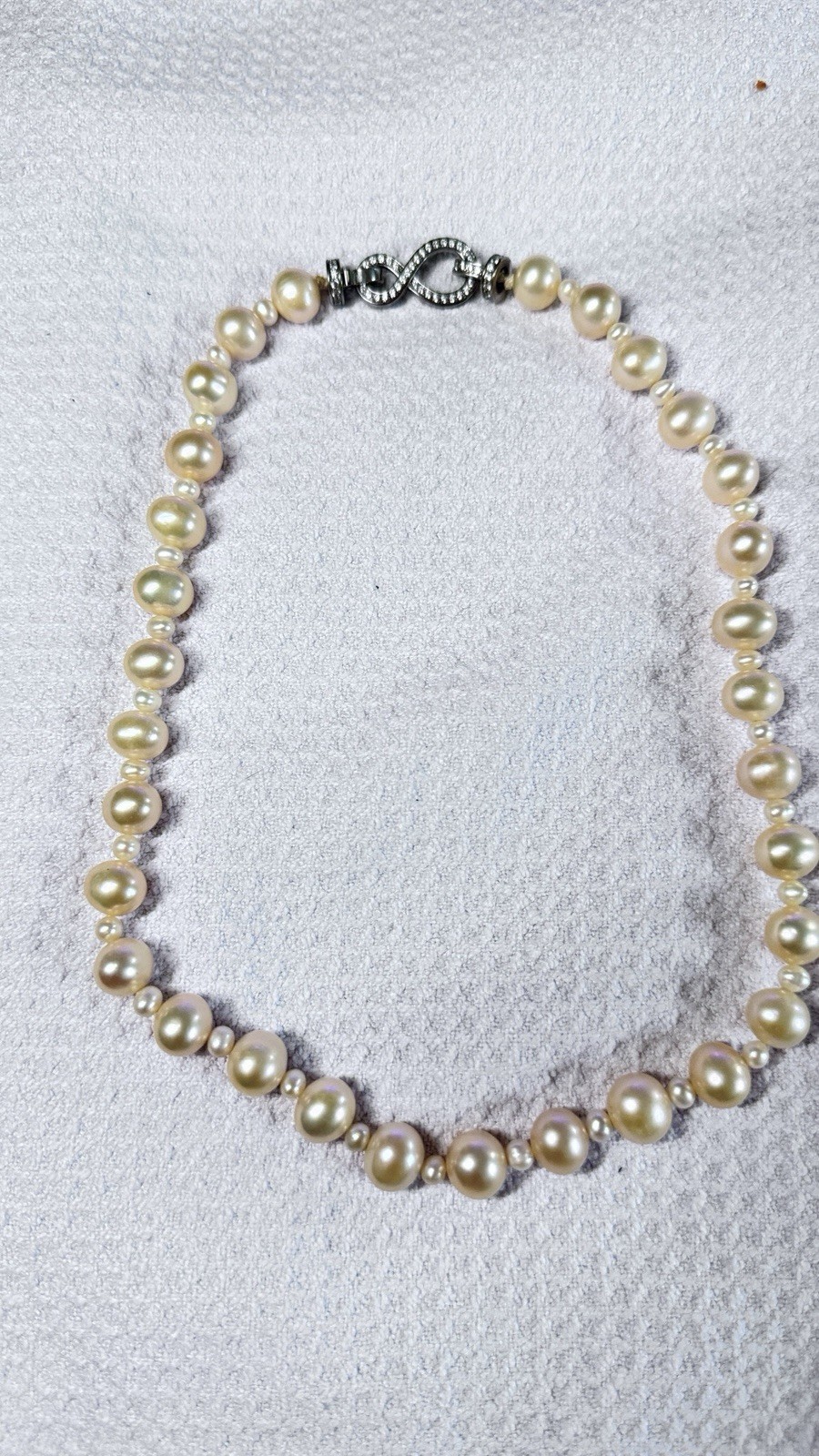 High-quality freshwater pearls with natural aurora luster. (11mm–12mm)