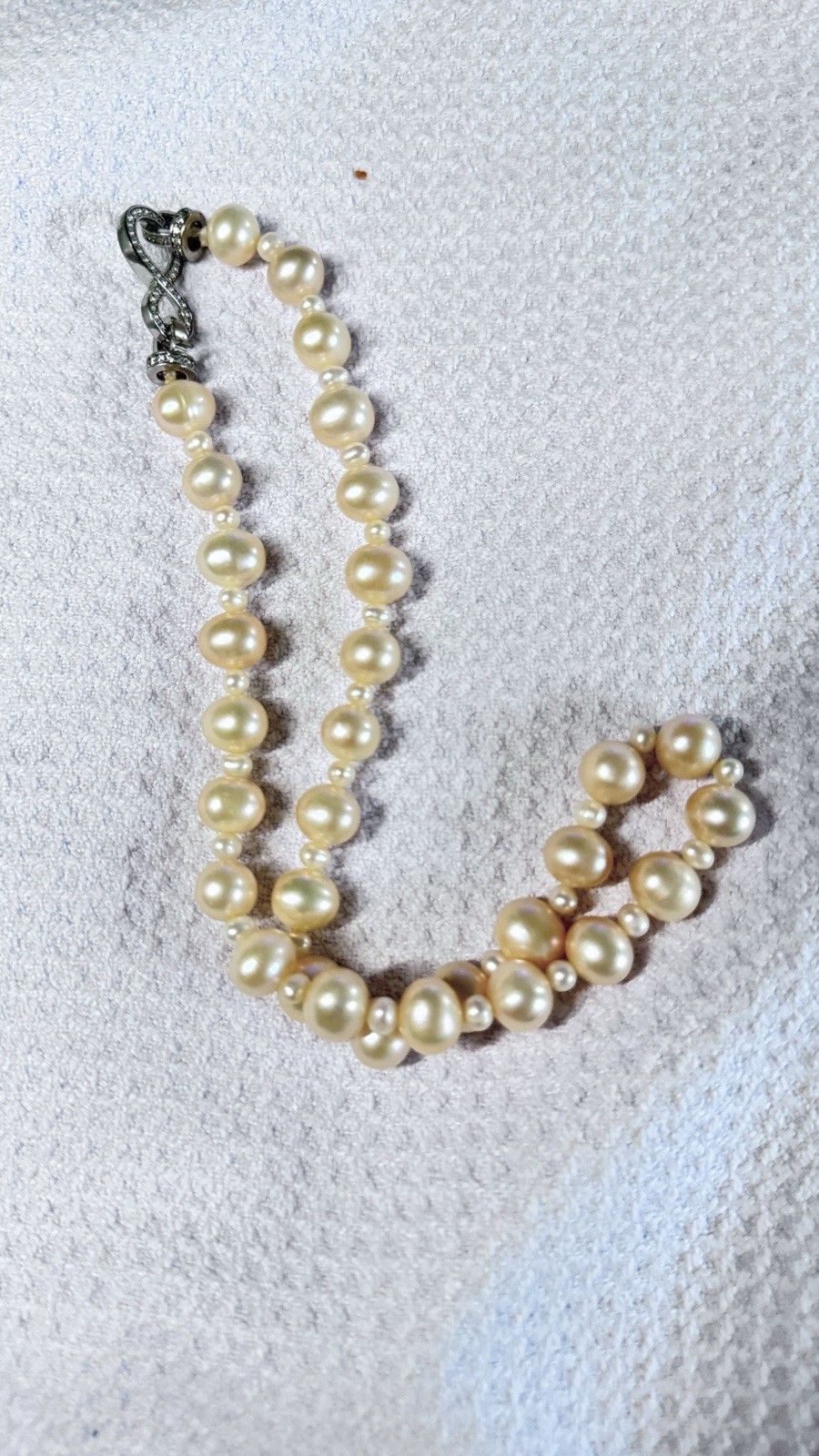 High-quality freshwater pearls with natural aurora luster. (11mm–12mm)