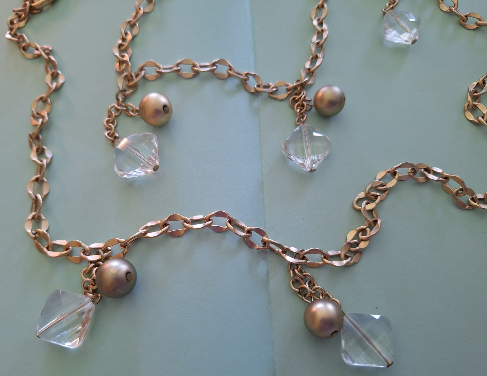 CHICO’S 18 INCH LONG GOLD COLORED BALLS AND COLORLESS STONE STATEMENT NECKLACE