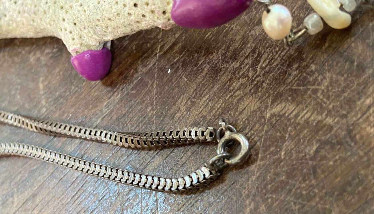Handcrafted Coral Necklace with Purple Clay Accents and Spiritual Charms